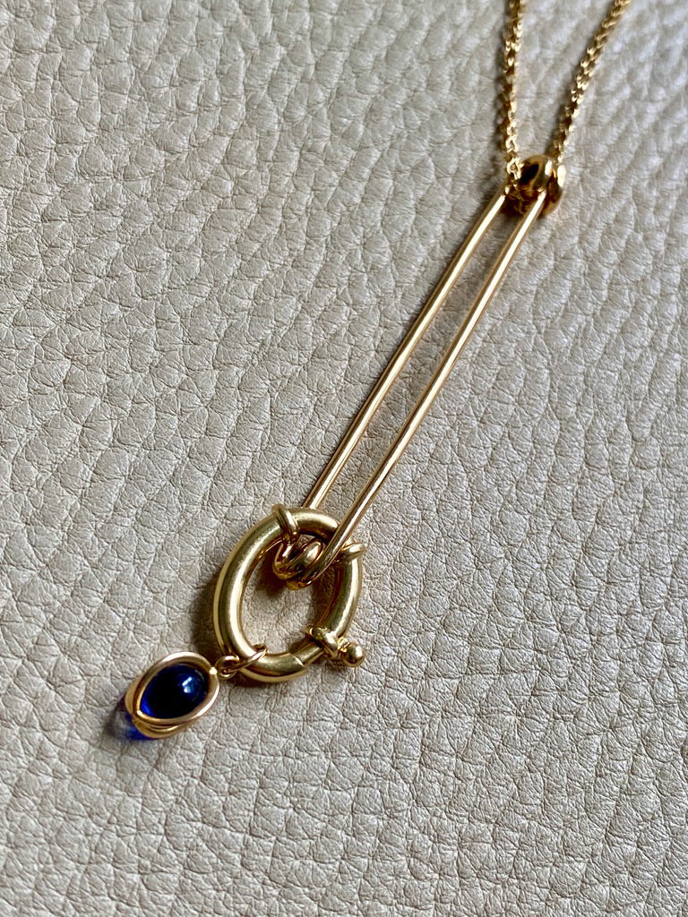 18k gold caged blue stone pendant or charm