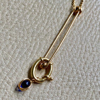 18k gold caged blue stone pendant or charm