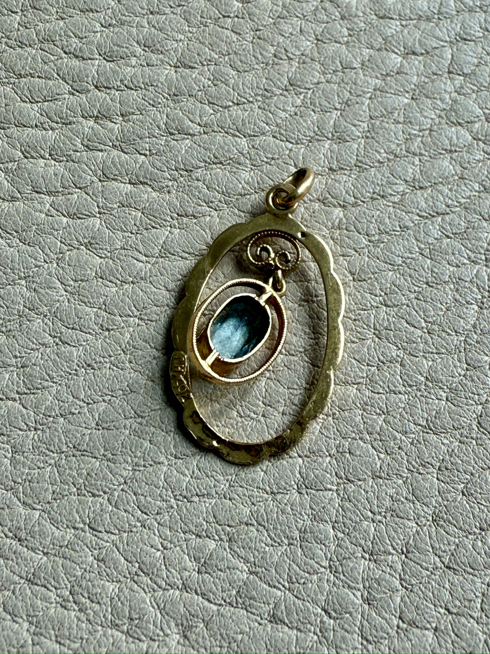 Victorian era Oval Pendant with Pale Blue Faceted Stone set in 18k Gold, Signed