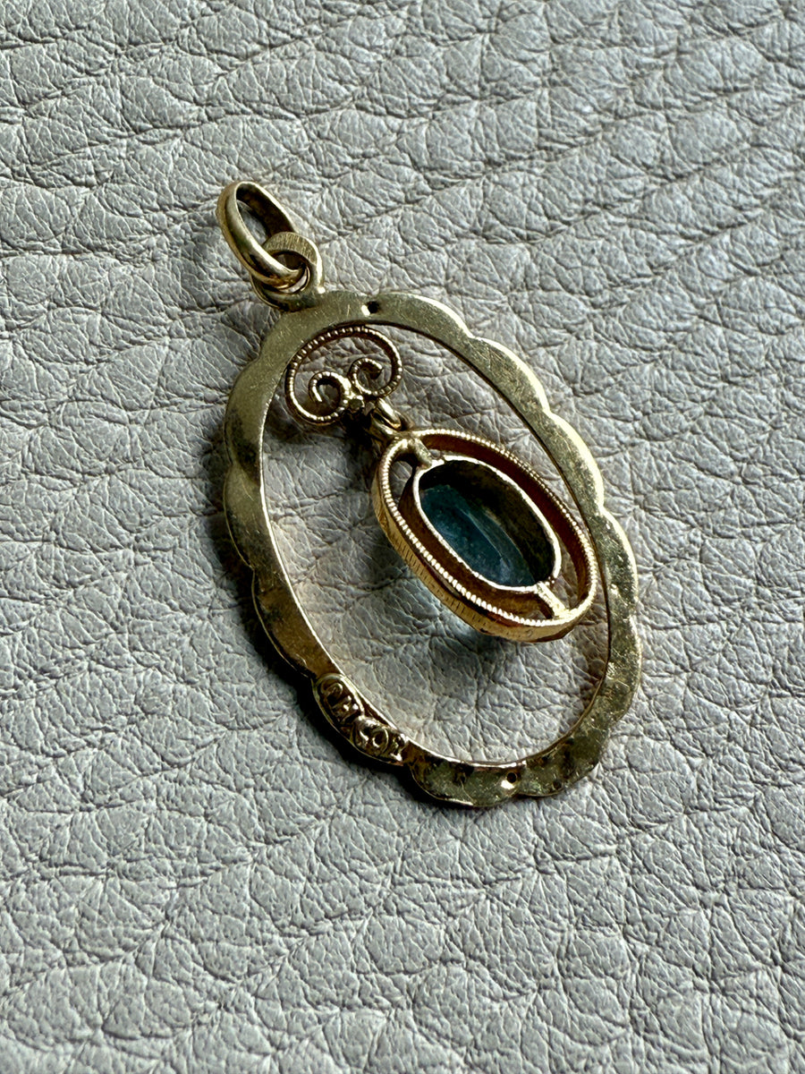 Victorian era Oval Pendant with Pale Blue Faceted Stone set in 18k Gold, Signed