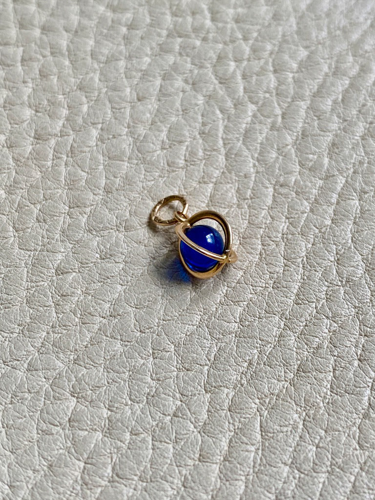 18k gold caged blue stone pendant or charm