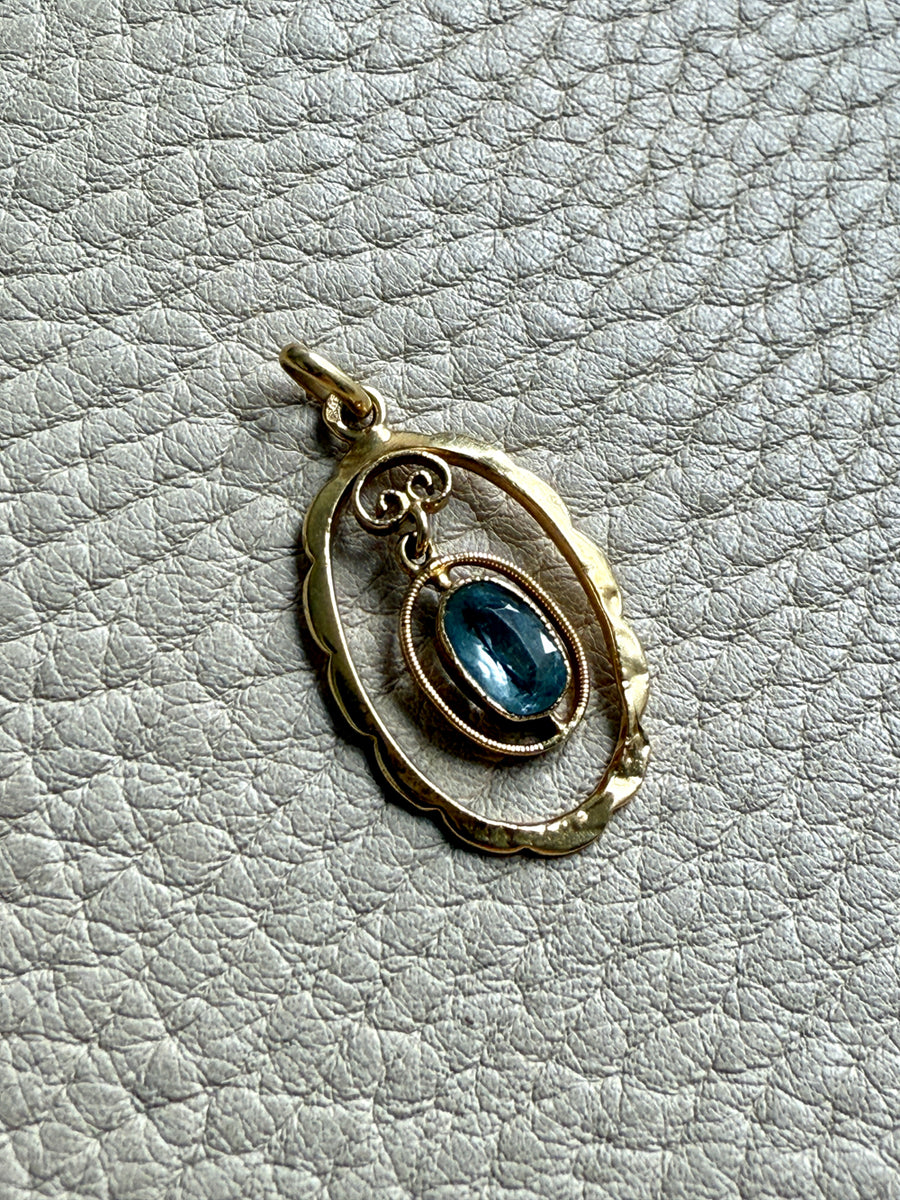 Victorian era Oval Pendant with Pale Blue Faceted Stone set in 18k Gold, Signed