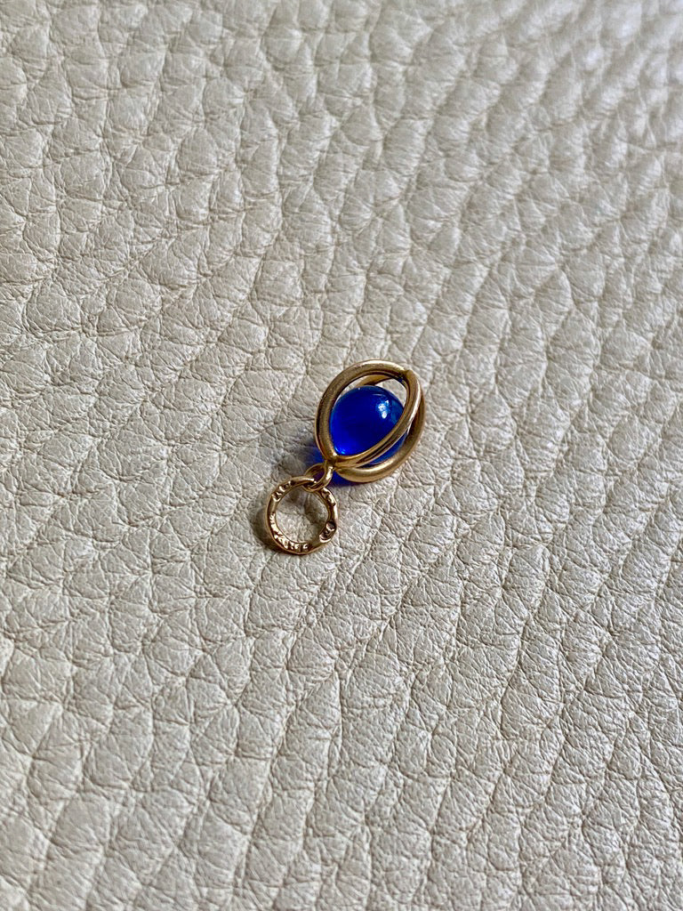 18k gold caged blue stone pendant or charm