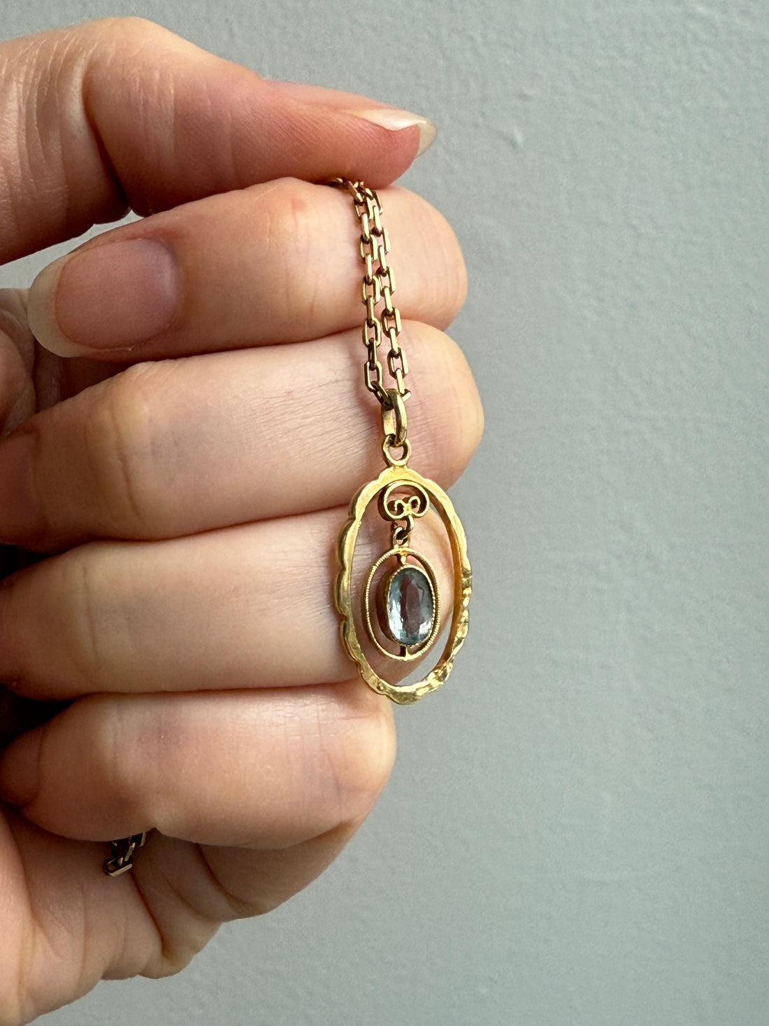 Victorian era Oval Pendant with Pale Blue Faceted Stone set in 18k Gold, Signed