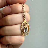 Victorian era Oval Pendant with Pale Blue Faceted Stone set in 18k Gold, Signed