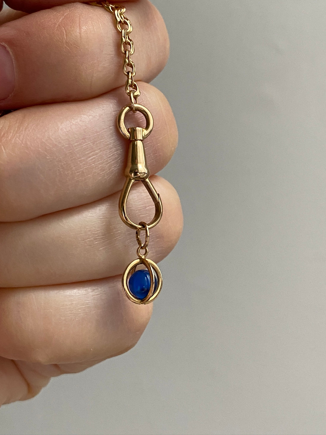 18k gold caged blue stone pendant or charm